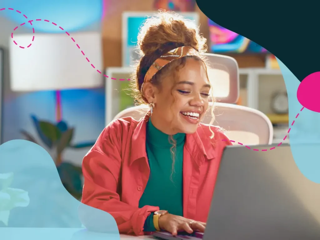 Women smiling at laptop