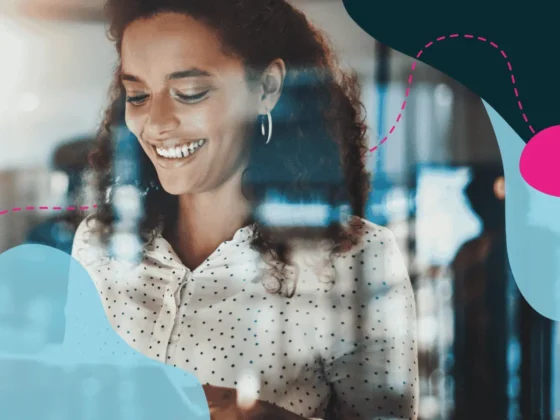 Woman looking at a screen smiling