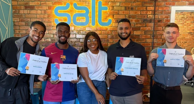 Group of colleagues at Salt holding certificates of completion and smiling