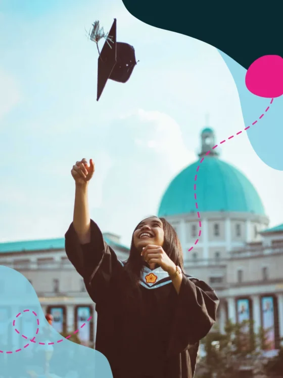 A graduate happily throwing her academic cap into the air