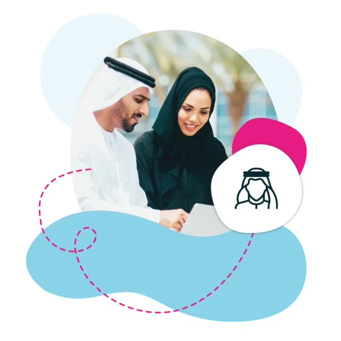 Emirati male and female working on a laptop outside