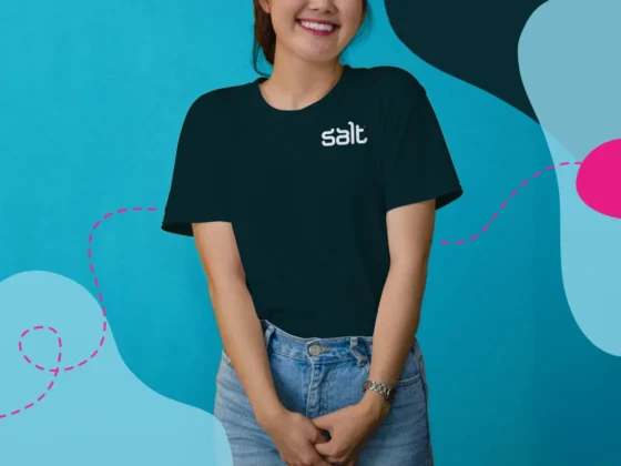 Woman wearing Salt branded t-shirt smiling