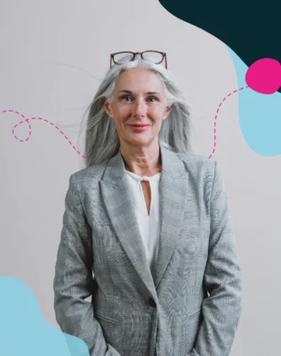 Headshot of a woman with long gray hair wearing a blazer