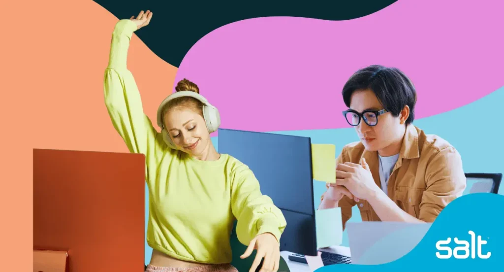 Two people in the office, looking happy and focused