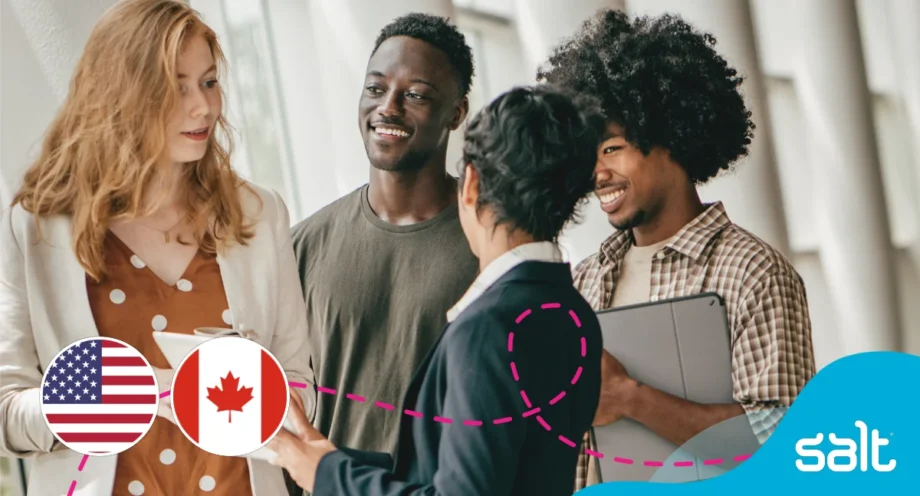 Four diverse coworkers engaged in a friendly conversation