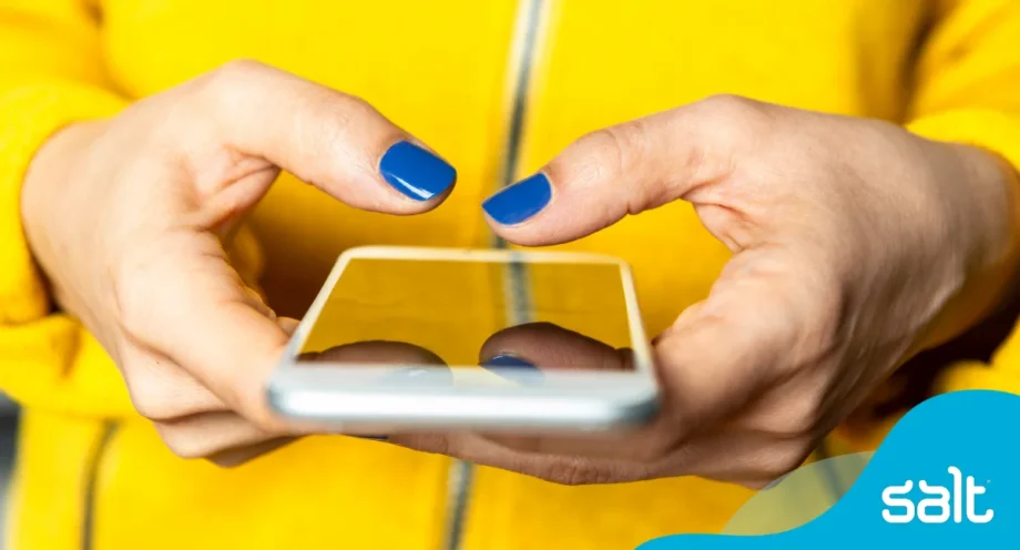 Close up of someone using their phone in both hands