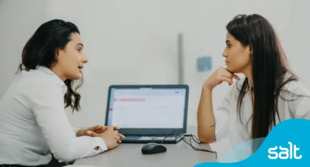 Two women discussing at a laptop