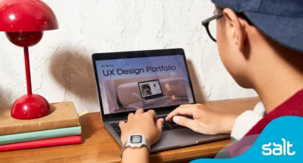 Man working on his UX Design portfolio on his laptop