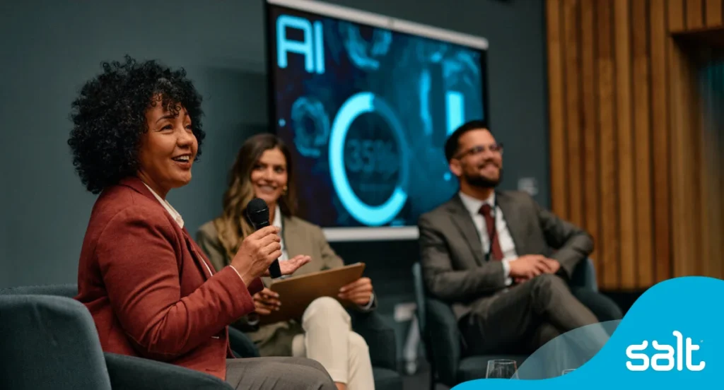 A group of leaders on a panel discussing AI