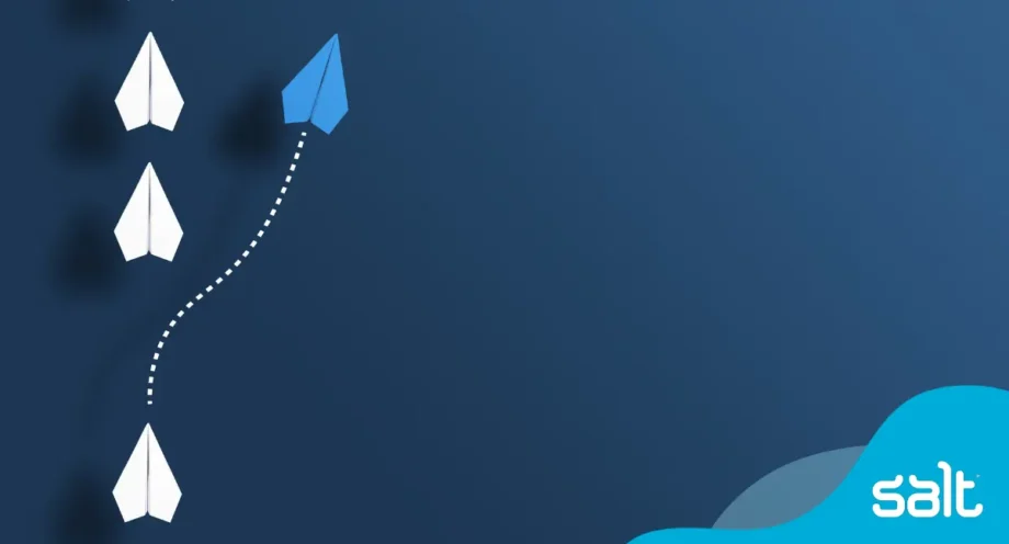 Blue paper plane breaking away from a group of white planes, symbolising innovative leadership in the digital era