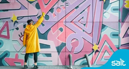 Man spray painting a wall