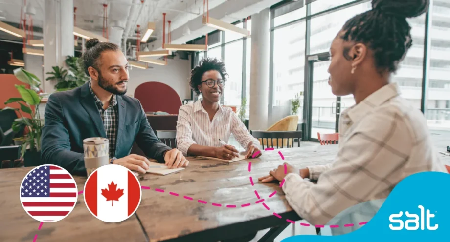 People sat at an office desk conducting an interview