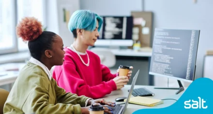 Two Gen Z coworkers working together in an office