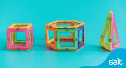 Colourful and bright magnetic tiles stuck together building shapes