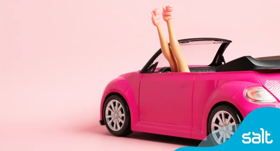 Barbie car with barbie in high heels in the car