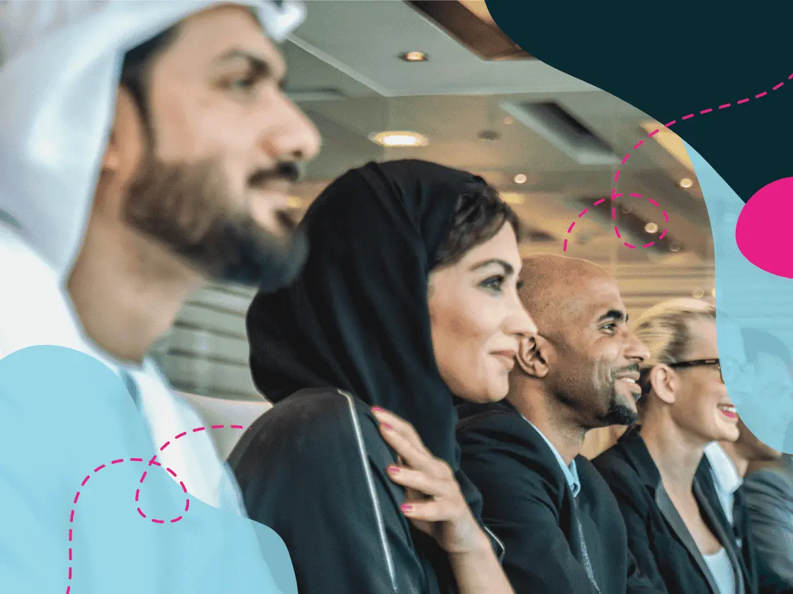 Emirati colleagues at a boardroom meeting table