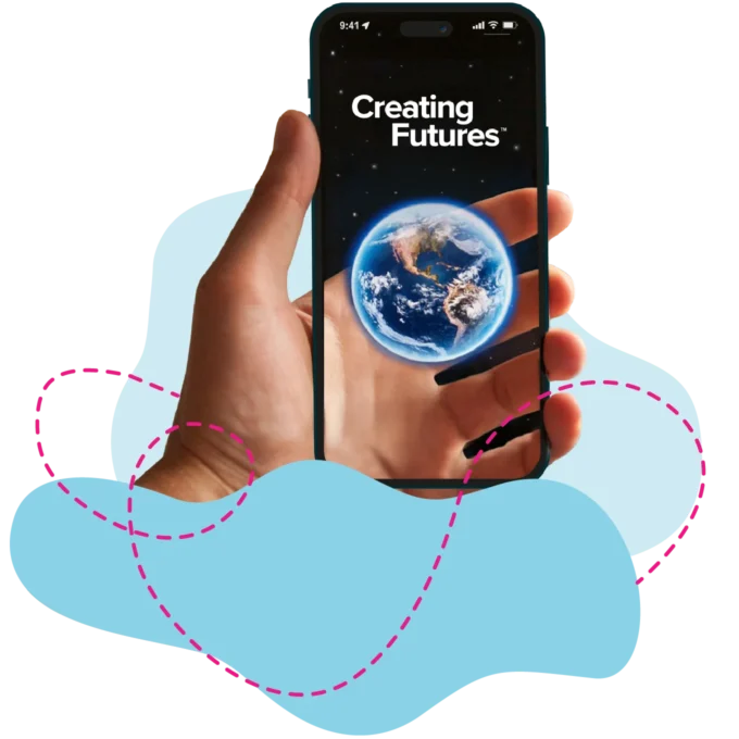 A hand holding a smartphone and on the screen it has the wording “Creating Futures” followed by a picture of the earth on the screen, symbolising global impact and innovation — homepage hero image