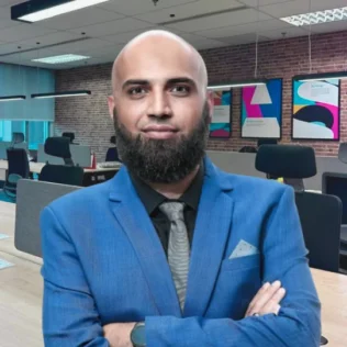 Hassan Khan headshot in a Salt office
