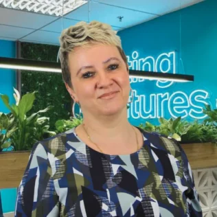 Inna Sydorova headshot in a Salt office
