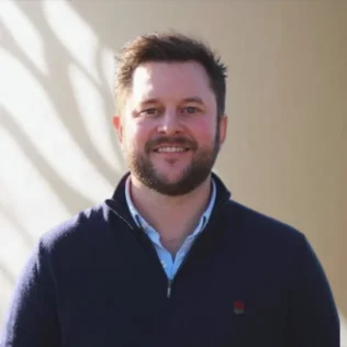 Jamie Burley headshot in a Salt office