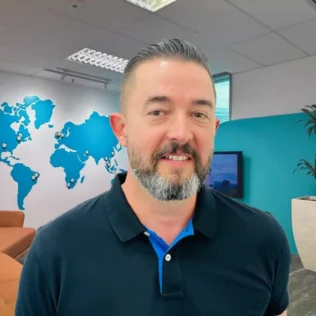 David Delbequ headshot in a Salt office