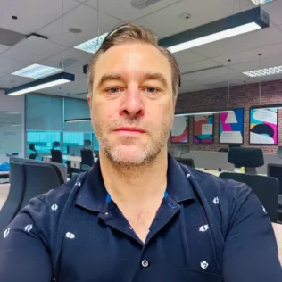 Graham Walker headshot in a Salt office