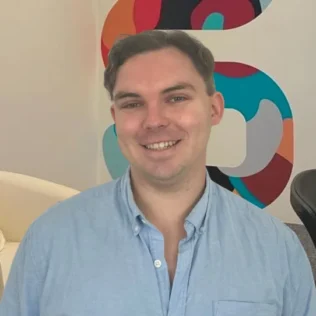 Jimmy Flynn headshot in a Salt office